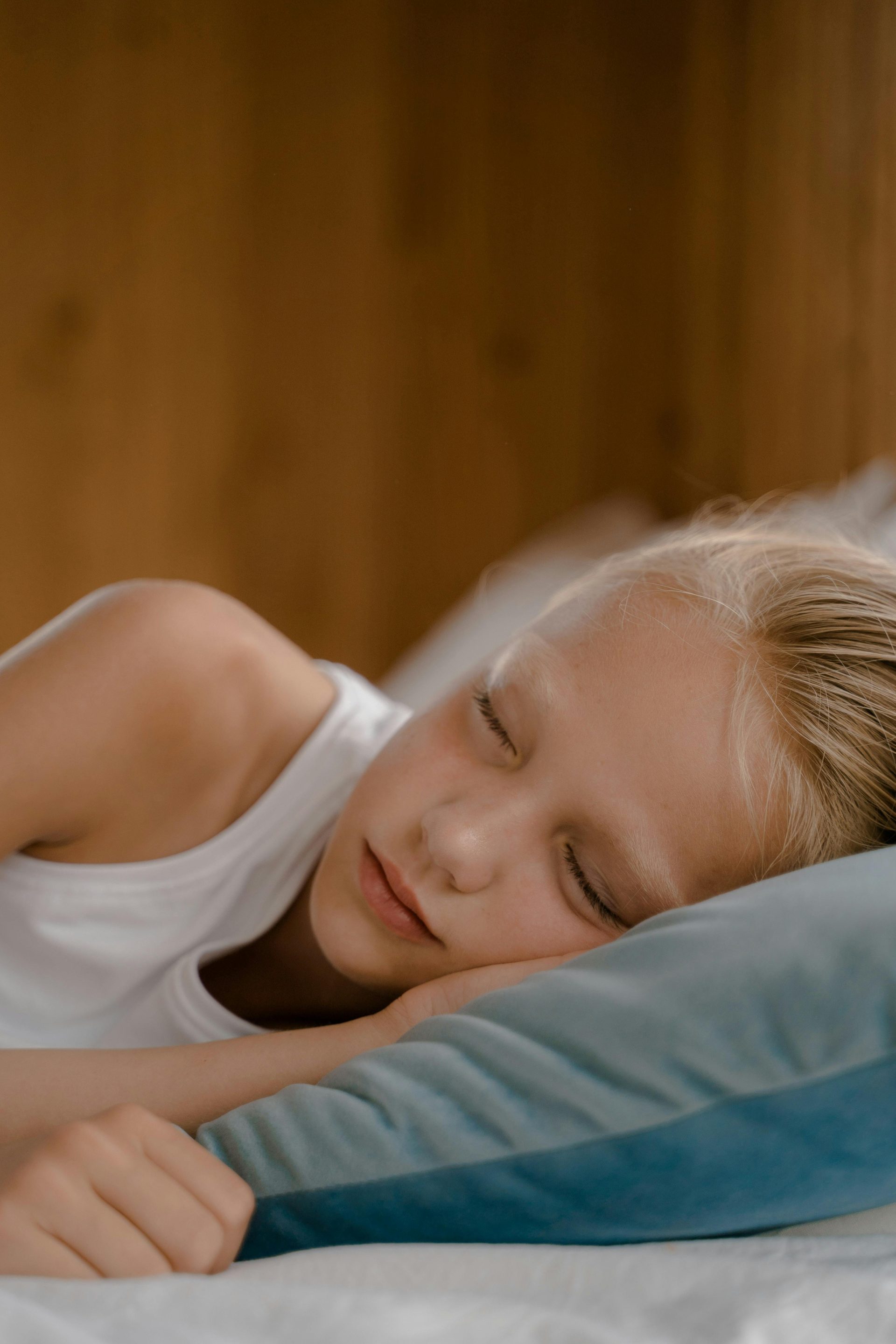 A serene image of a child sleeping peacefully, exuding tranquility and comfort.